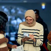 International Anchor Allies Winter 2026 First Mixer - a student completing her sheet